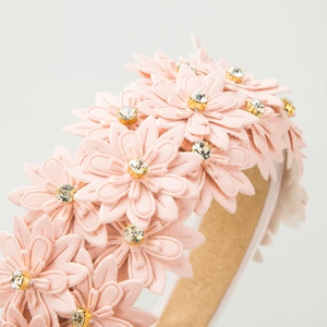 Pink faux leather floral headband with sparkling crystal centers and sponge wide band