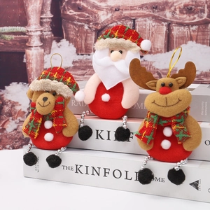 Three plush Christmas tree ornaments featuring Santa, reindeer, and bear with red velvet
