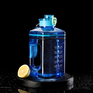 Close-up of 2.2L blue sports water bottle with time markers and fresh water droplets