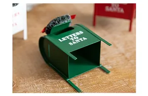 Close-up of green metal Christmas mailbox ornament with white Letters to Santa text