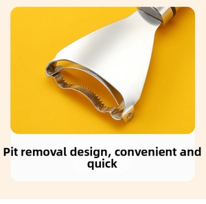 Close-up of stainless steel corn peeler showing the integrated bud remover design
