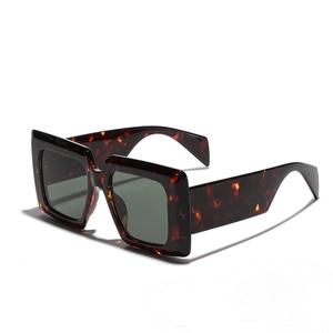 Stylish square tortoise shell sunglasses with oversized frames and dark UV lenses