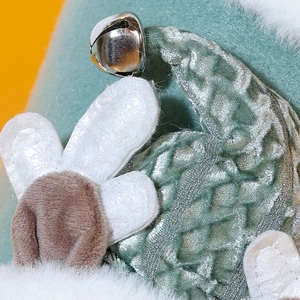 Festive Christmas stocking with silver metal bell, white felt petal, and green mesh fabric