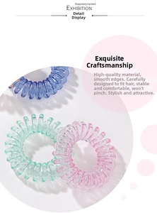 Detail of colorful spiral hair ties in purple, pink, and green showing elastic resin texture