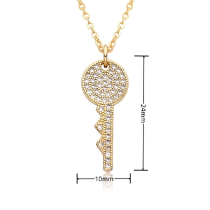 Detail showing 24mm x 10mm 18k gold heart key pendant with sparkling zircon stones