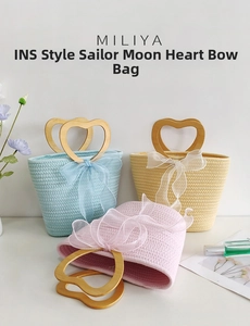Detailed view of handmade woven straw bags with heart shaped wooden handles and organza bows