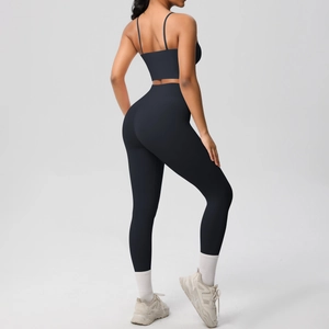 Rear view of black seamless yoga set showing high waist leggings and thin strap sports bra
