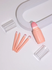 Detailed view of pink 5-in-1 retractable makeup brush set with synthetic bristles