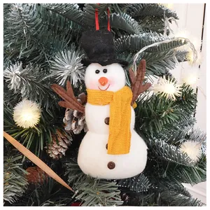 Detailed plush snowman ornament with yellow scarf hanging on a festive Christmas tree