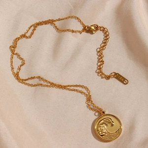 18K gold plated stainless steel necklace with round ocean wave relief pendant on silk
