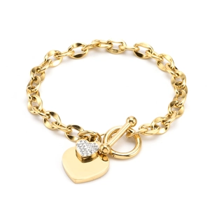 Detail of gold heart pendant bracelet with toggle clasp and sparkling rhinestones
