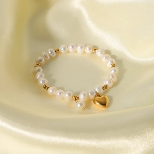 French freshwater pearl and gold steel bead bracelet with a polished heart pendant
