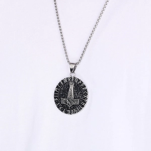 Detailed view of silver Viking Mjölnir pendant with runes on a stainless steel chain