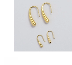 Detail of high-polished teardrop earrings in 18K gold plated steel, two sizes shown