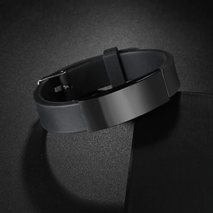 Minimalist black silicone bracelet with polished metal plate and adjustable watch buckle