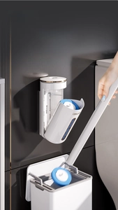 Detail of wall-mounted disposable toilet brush set with blue cleaning sponge head
