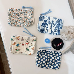 Set of four floral cotton mini pouches with zipper closure for coins and cosmetics
