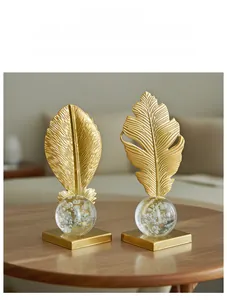 Detail of Nordic golden leaf sculptures with bubble crystal balls on square bases