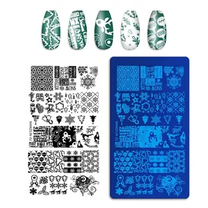Macro shot of stainless steel nail plate featuring Christmas deer and snowflake patterns