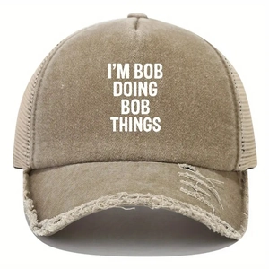 Detail of distressed khaki trucker hat featuring I'M BOB DOING BOB THINGS white text