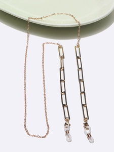 Macro detail of rectangle link glasses chain in rose gold finish with silicone loop