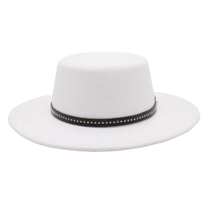 Detail of white wool boater hat featuring a black band with decorative gold studs