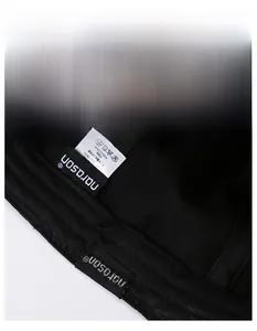 Close-up of the breathable sweatband and washing label inside the black vintage baseball cap