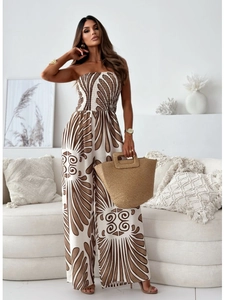 Detail of summer strapless jumpsuit with brown and white floral pattern and wide legs