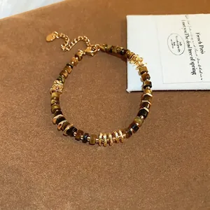 Faux tiger eye beaded geometric bracelet with gold-tone accents and heart charm