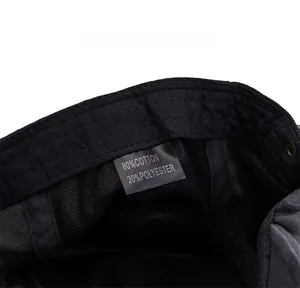 Detail view of cotton-polyester lining with care label and metallic eyelets on beret
