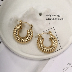 Detail view of 2.1cm twisted gold hoop earrings with 15.5g weight specifications