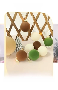 Detail view of 8cm flocked Christmas ball ornaments in earthy tones for tree decoration