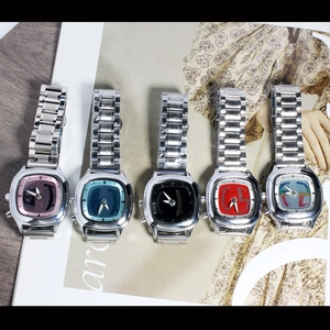 Close-up detail of vintage style men's alloy quartz watches featuring multiple colored dials