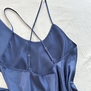 Deep blue silk satin nightgown featuring adjustable crisscross straps on a minimal back