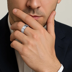 Men's 8mm silver stainless steel ring with geometric pattern worn on a hand