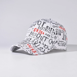 Detailed view of white baseball cap with black and red graffiti street art print
