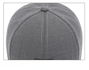 Detail shot of the precise stitching on the crown of the grey mesh baseball cap