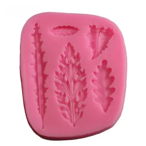 Detail of pink silicone mold featuring various leaf textures like oak and pinnate shapes