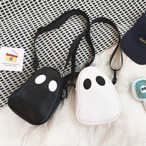 Detailed view of ghost-shaped PU crossbody bag with contrasting eyes and adjustable strap