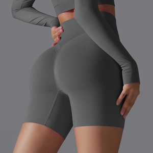 Detail view of seamless dark gray high-waisted gym shorts with peach lift effect
