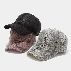 Snake skin pattern baseball caps in black pink and white with textured leather finish