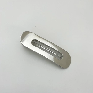 Close-up of sleek silver-colored alloy hair clip with minimalist hollow oval design
