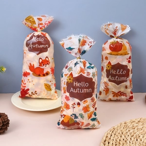 Autumn themed Thanksgiving gift bags with maple leaf and squirrel prints for candy packaging
