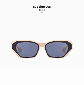 Detail view of beige cat-eye sunglasses with contrasting black rims and dark lenses