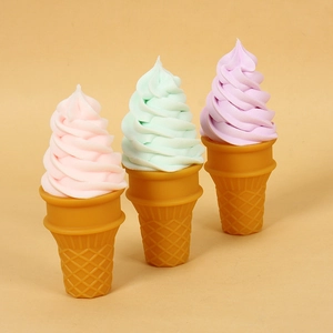 Set of pastel simulated ice cream cone models in pink, mint green, and light purple tones