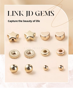 Flat lay of gold plated acrylic beads in heart, star, and round shapes for DIY jewelry
