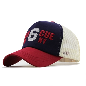 Navy and red mesh trucker hat featuring white number 6 and NY embroidery on white background