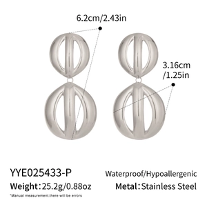 Detailed view of large silver stainless steel hollow geometric ball earrings with dimensions