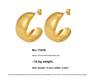 Detail of chunky C-shape hoop earrings showing 3.3cm size and polished gold steel finish