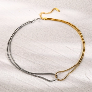 Detail of 18k gold and silver two-tone flat snake chain necklace with K18 tag